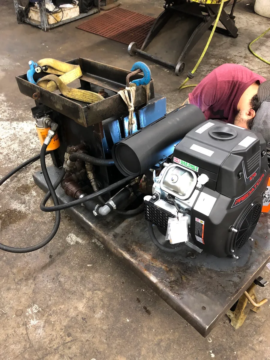 Small engine on a service bench in Garland Saw’s workshop