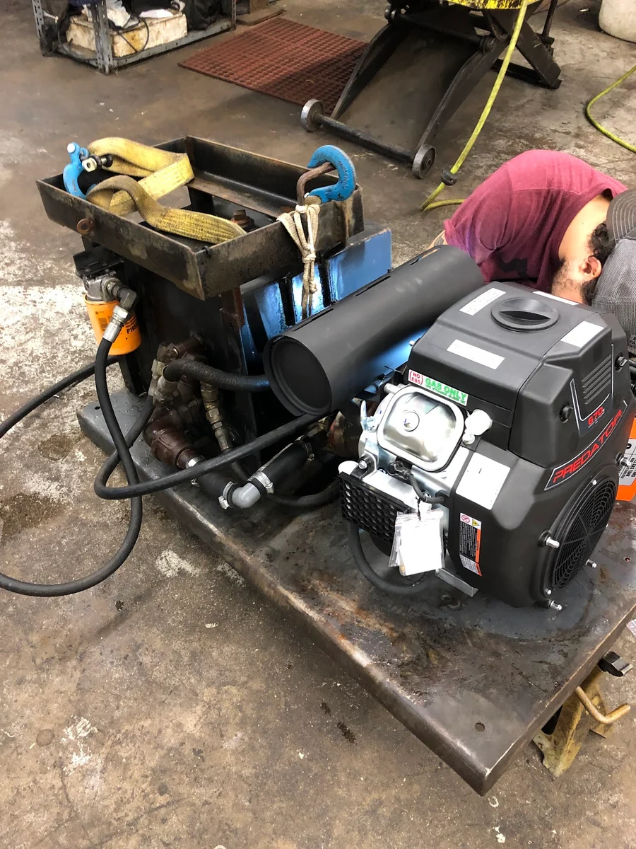 Small engine on a service bench in Garland Saw’s workshop
