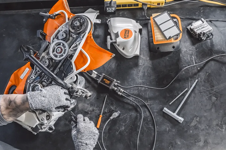STIHL TS 440 cut-off saw being serviced on a workbench