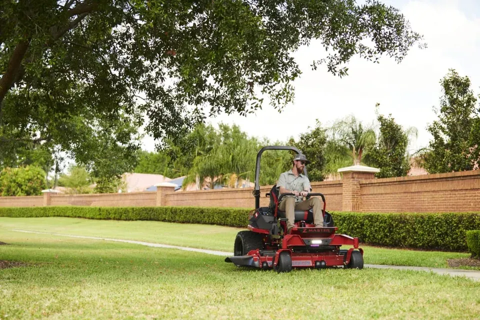 Operator mowing with a Toro zero-turn riding mower