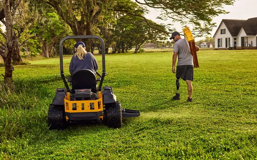 Riding mower being used for residential lawn care
