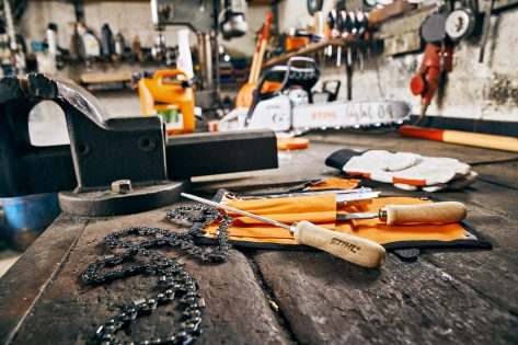 Saw-chain files and maintenance tools on a workshop bench