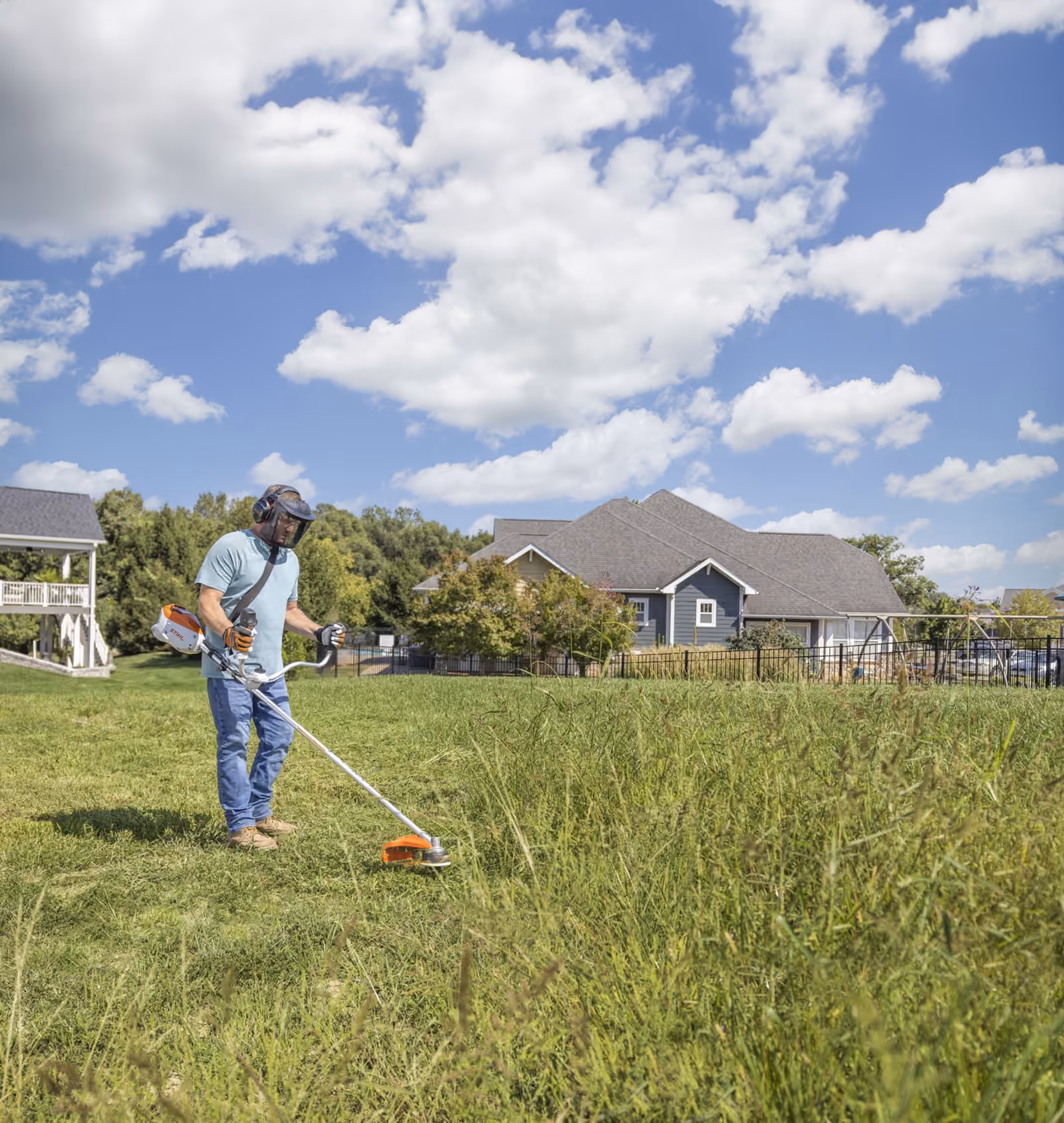 STIHL battery trimmer cutting grass