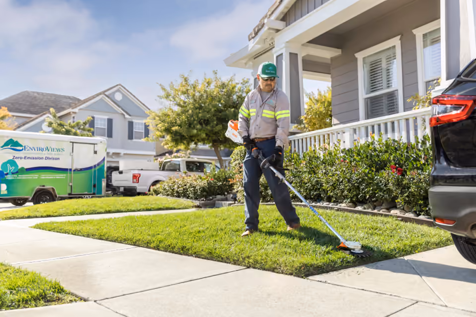STIHL battery KombiSystem trimming grass with an optional attachment
