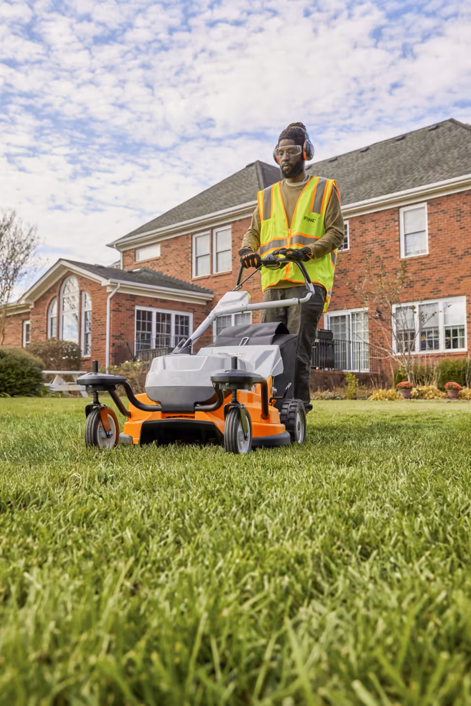 Operator mowing with a STIHL battery mower